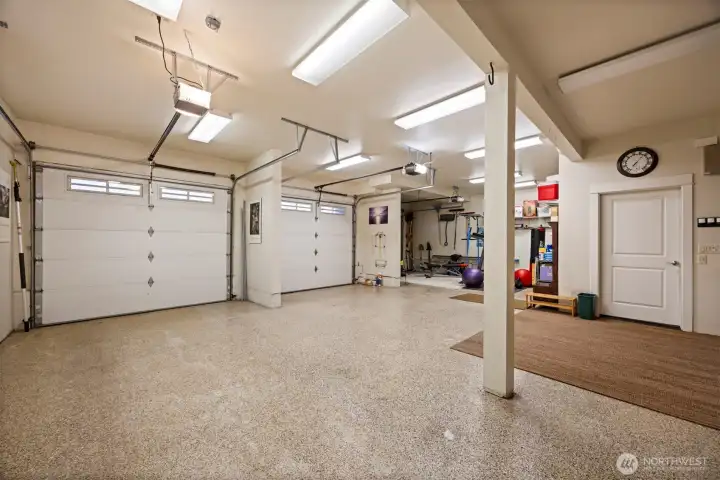 The garage is 901 sf and has 3 bays with automatic doors, and a work bench area and cabinet storage, as well. It also has an epoxy floor.