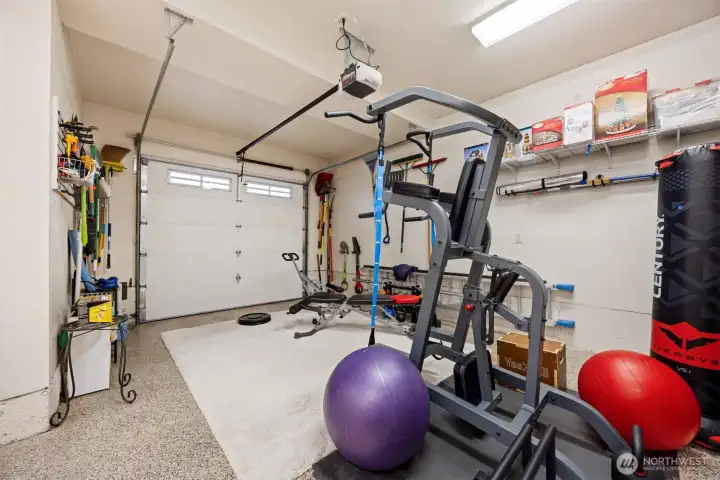 One bay of the garage has been used as a work-out area.