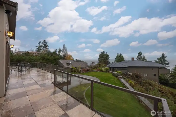 Looking toward the south over the additional parking and the homes below, with the bay and San Juan Island views beyond.