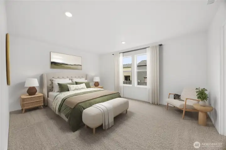 Large picture windows let in lots of light in the primary suite with ensuite.  Virtually Staged.