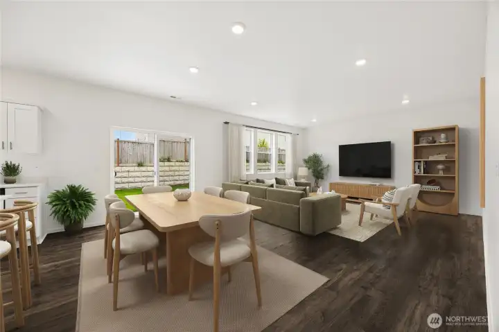 Great room gets lots of natural light with expansive windows.  Room is virtually staged.
