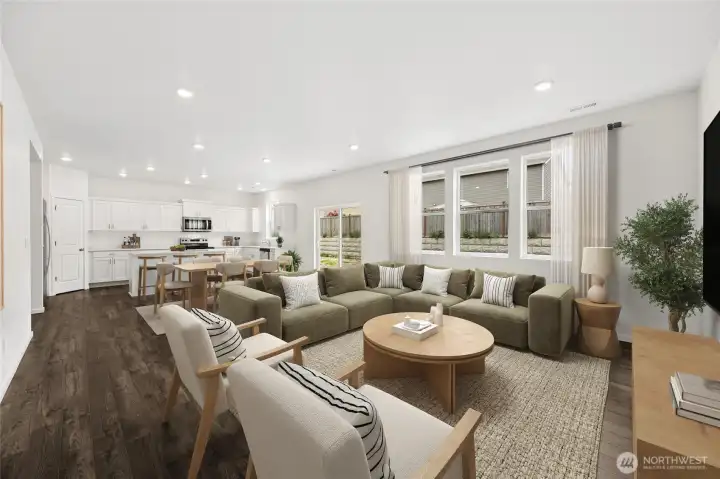 Another view showing many windows that let in the natural light and the spacious great room.  Virtually staged.