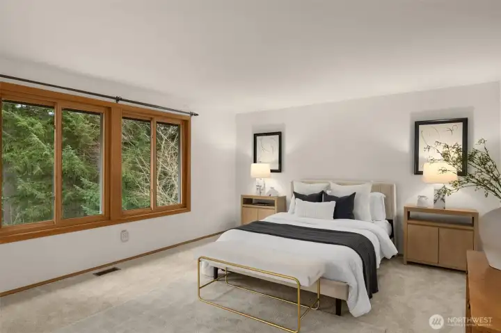 Primary bedroom is spacious and peaceful