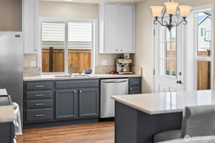 The covered back patio offers protection from the elements between the home and garage.