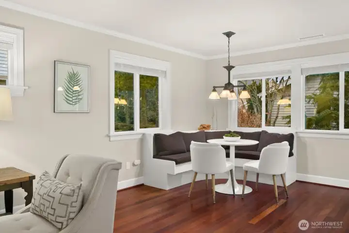 Custom features include wood wrapped windows, hardwood floors, updated baseboards and crown molding