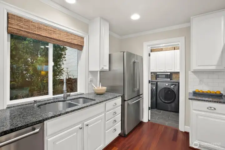 You will appreciate the walk-in pantry and utility room located conveniently in the kitchen