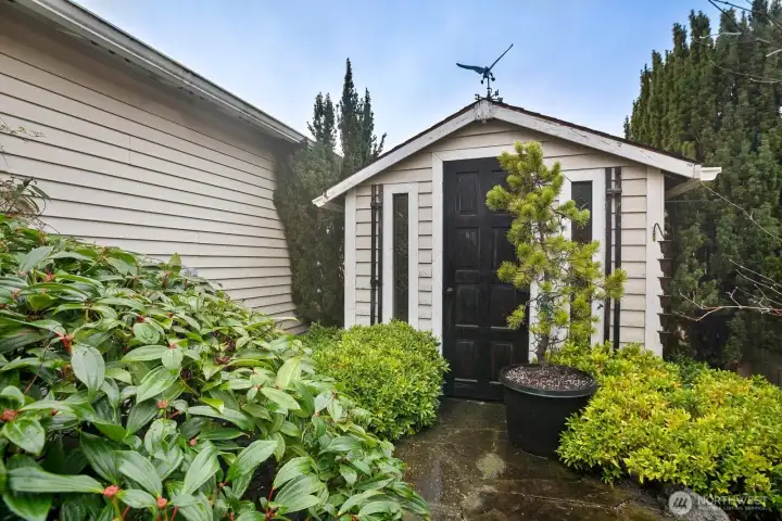 Garden shed is not only functional but charming too!