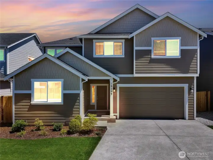 Photos are taken of a Shelby plan previously built in the community.