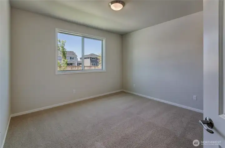 Photos are taken of a Shelby plan previously built in the community.