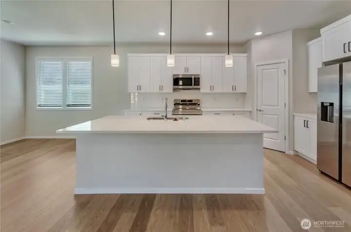 Photos are taken of a Shelby plan previously built in the community.