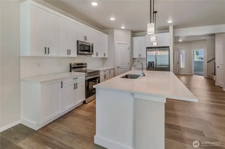 Photos are taken of a Shelby plan previously built in the community.