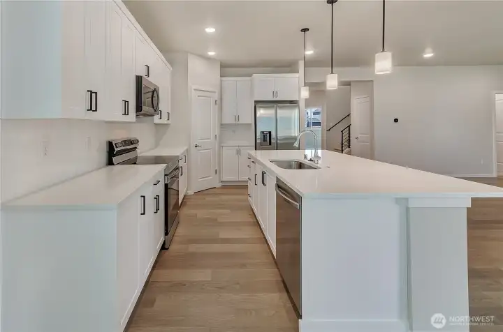 Photos are taken of a Shelby plan previously built in the community.