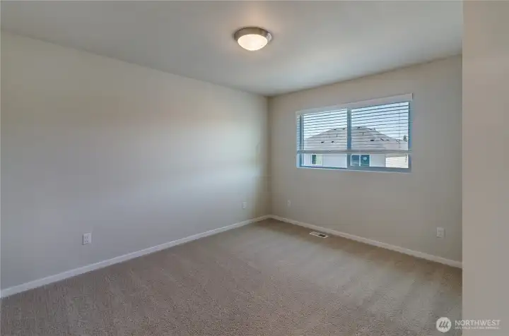 Photos are taken of a Shelby plan previously built in the community.