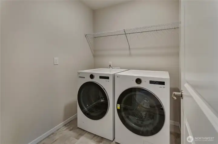 Photos are taken of a Shelby plan previously built in the community.