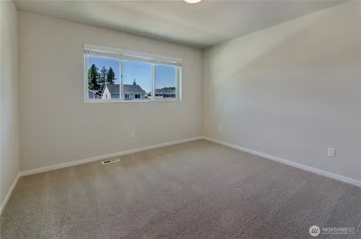 Photos are taken of a Shelby plan previously built in the community.