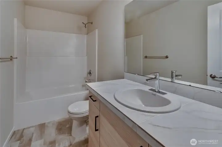 Photos are taken of a Shelby plan previously built in the community.