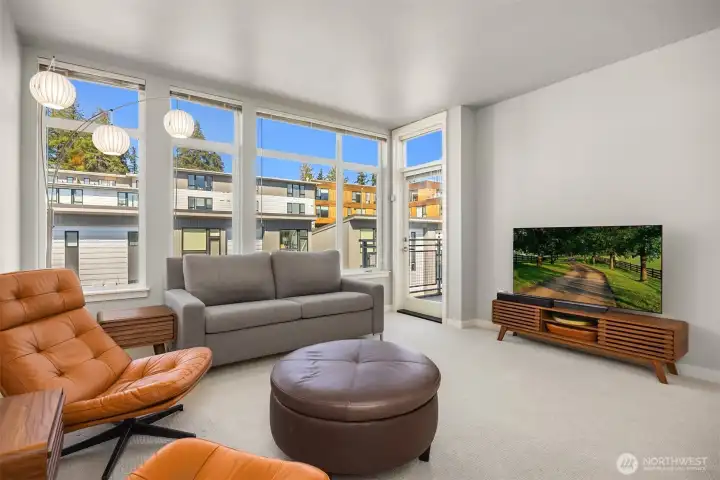 Sun-filled living spaces and a peaceful top-floor setting create an inviting place to relax.