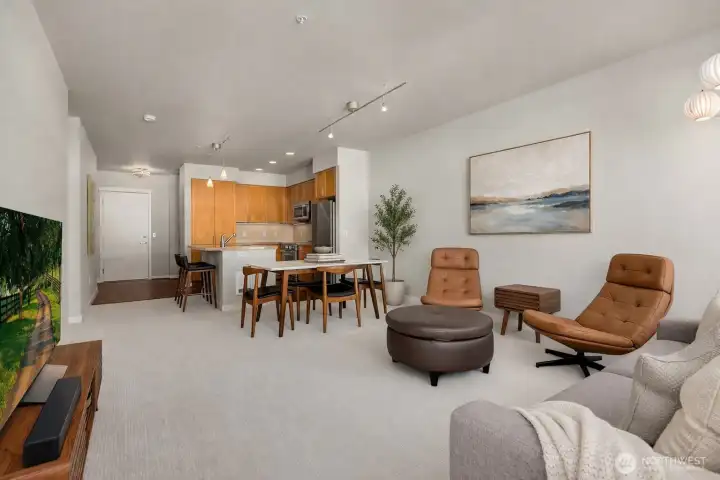 The open living and dining area feels bright and welcoming, with an easy flow that makes everyday living and entertaining feel effortless. Note: This image has some AI generated staging.