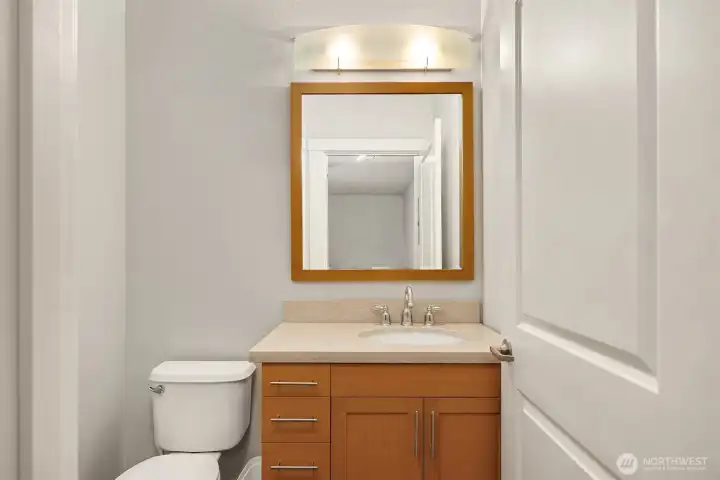 A separate powder room offers added convenience for guests.