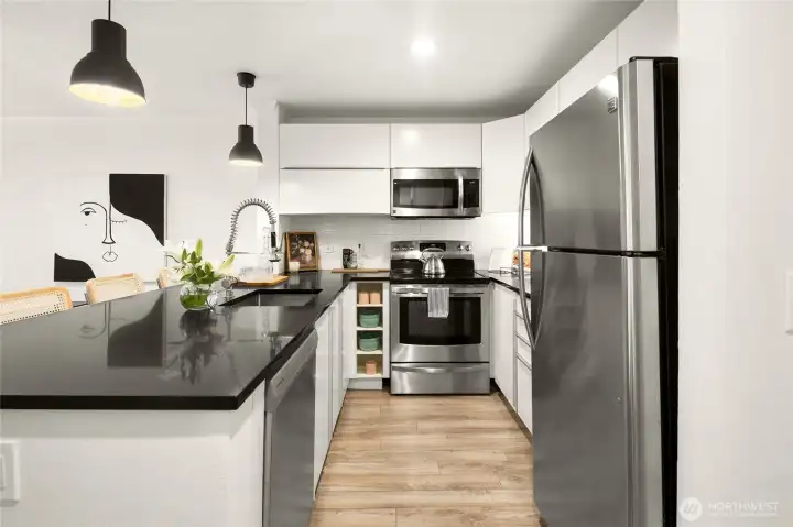 The kitchen has tongs of storage, as well as all stainless steel appliances.