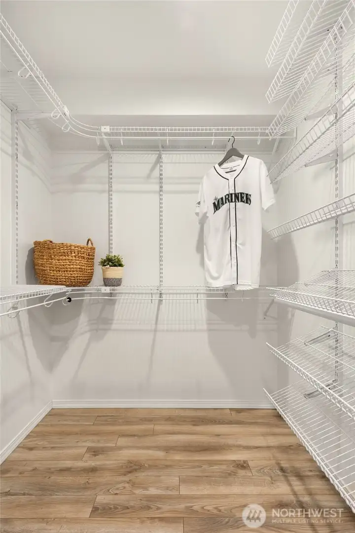 Large walk-in closet, one of several closets in the unit.