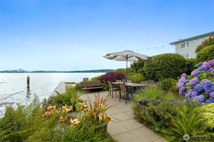Moorage dock for small watercraft, wade-in swim beach, and a dining/gathering space for BBQs!