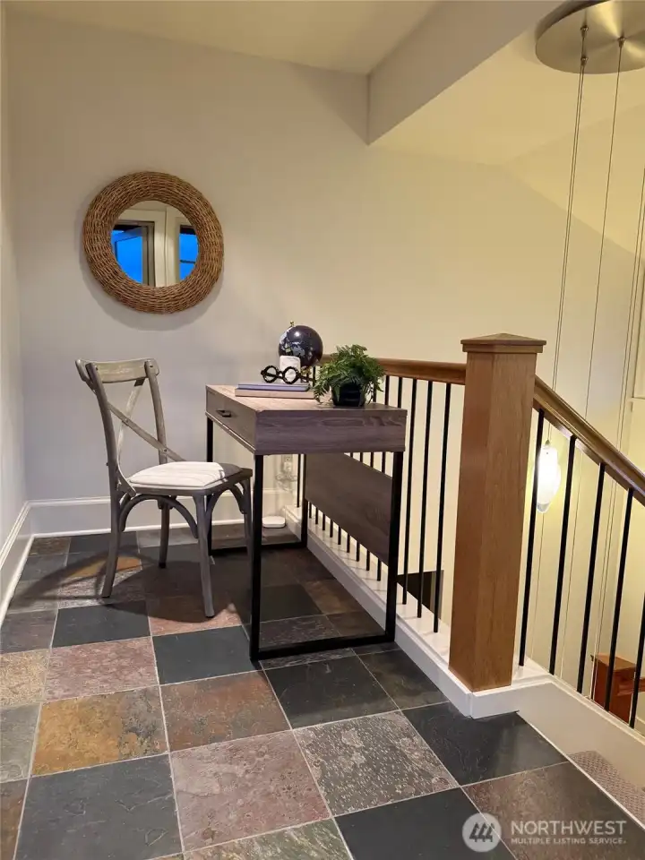 Perfect remote office space! Located at the top of the stairs, adjacent to the roof-top deck, enjoy views of the lake, Downtown Bellevue, and the Cascade mountain range. A delightful space to work from home.
