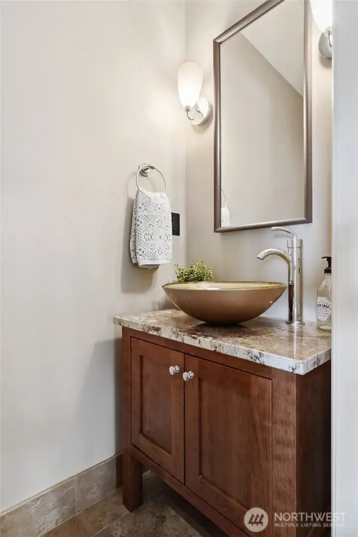 The powder room, conveniently located on the kitchen, living room and dining room level, is perfect for your guests.