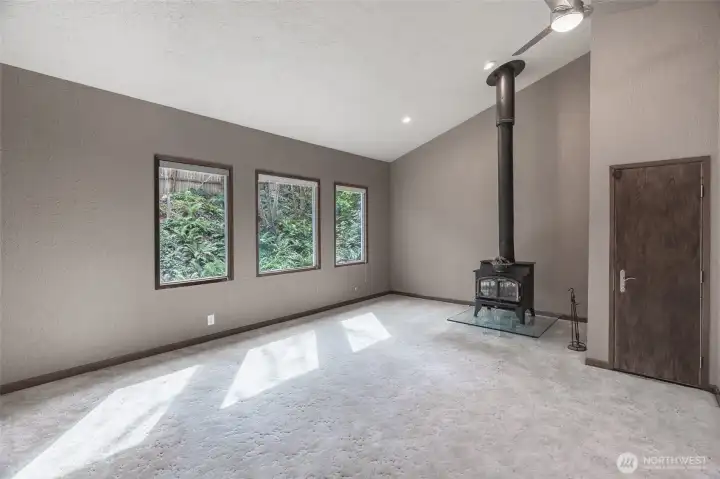 Great room right off the entry with wood burning fireplace