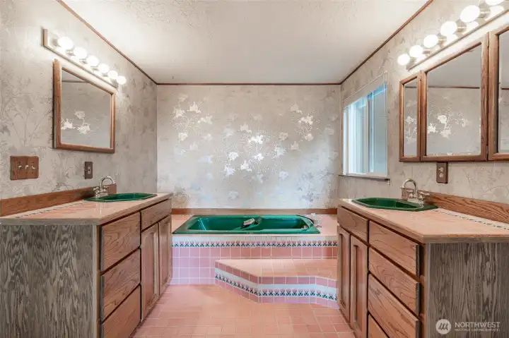 Open bathroom with dual sinks and large soaking tub!