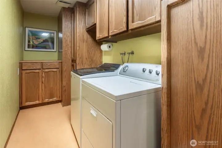 Separate laundry room with great storage!