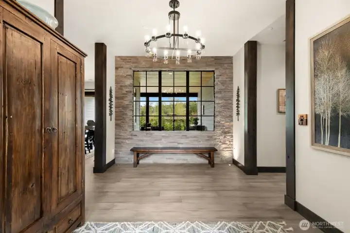 Grand entrance with wide plank wood floors throughout the main living areas