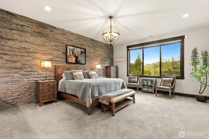 Primary suite with stack stone accent wall
