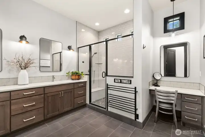 Primary bathroom features heated floors and separate vanity area