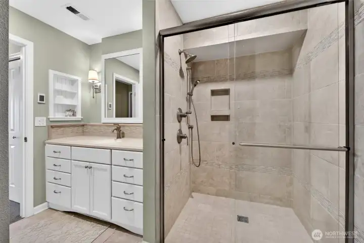 Upgraded custom tile shower was added by the owner