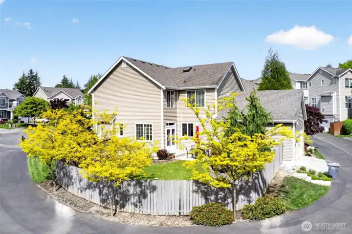 Beautiful landscaping surrounds the home. Sprinkler system installed to keep that grass green!