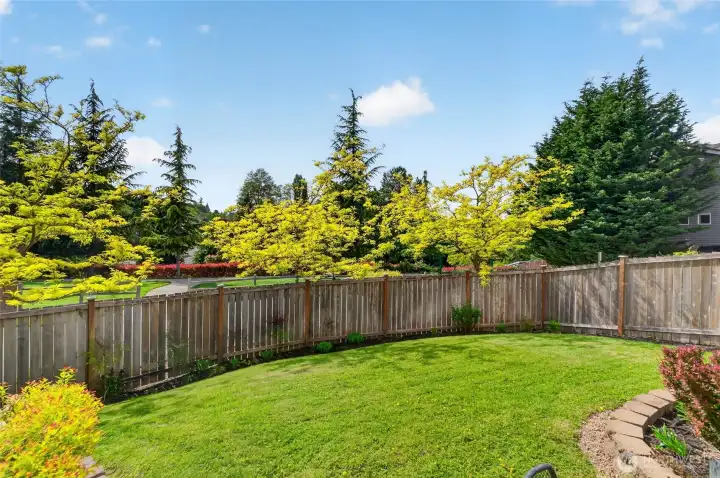 Do you have a green thumb? Add some potted plants/veggies/herbs or some raised beds. Beyond the fence, you will see the small park.