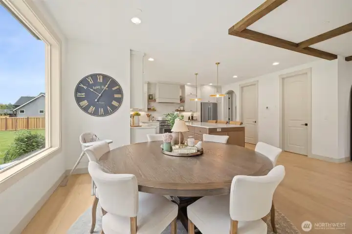 Bright, spacious kitchen with ample storage, dedicated eating area, and cozy breakfast nook perfect for entertaining.