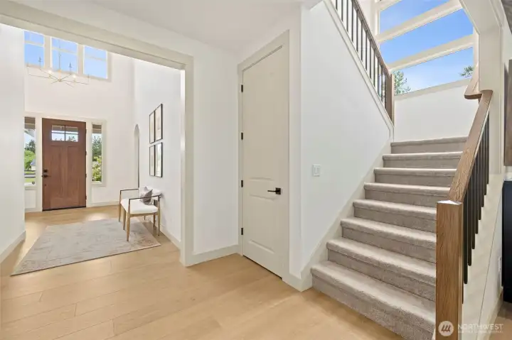 Spacious staircase leading to the upper-level bonus room.