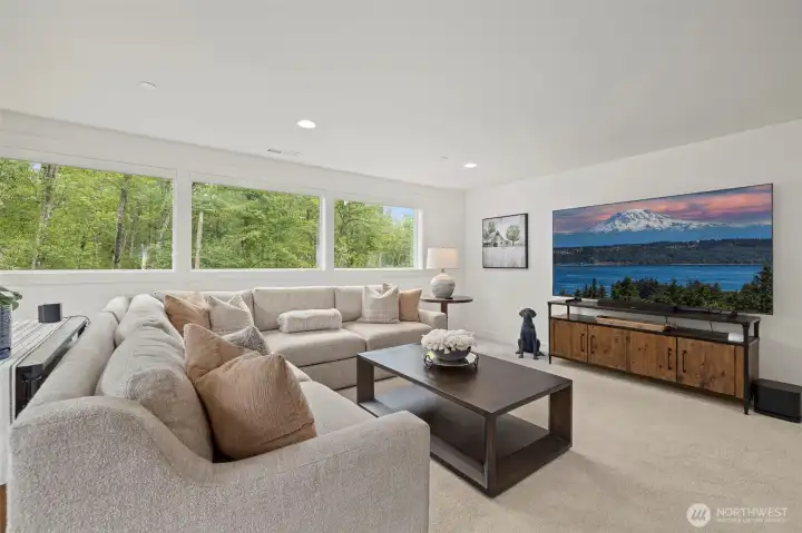 The upstairs bonus room is super versatile—it'd make a great home office, media room, or play area.