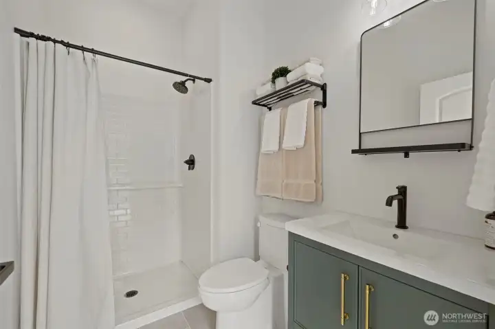 Detached shop with private 3/4 bathroom.