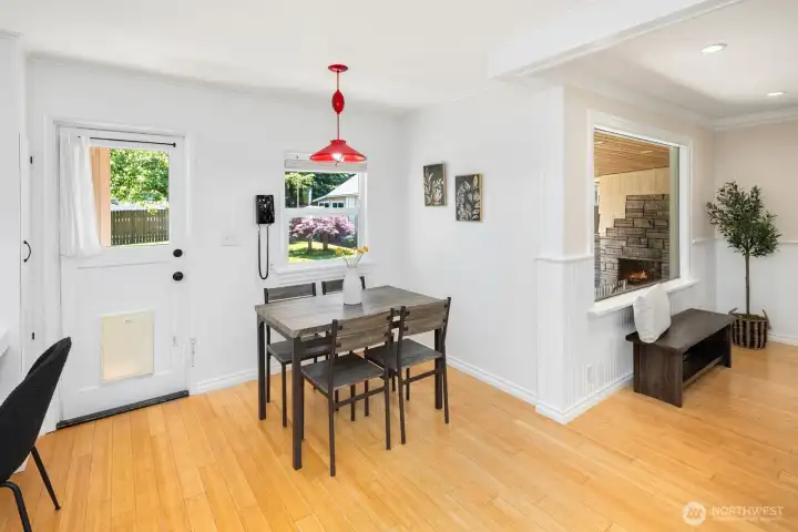 Enter the Eat in kitchen from the living room.  Backdoor with covered porch offers access to the yard.