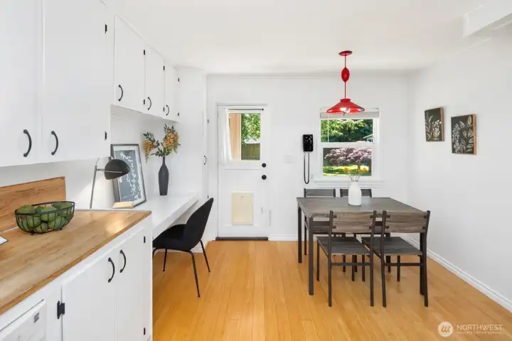 Eat-in Kitchen and desk.  Light and bright with lots of cabinets.  Lovely bamboo flooring.