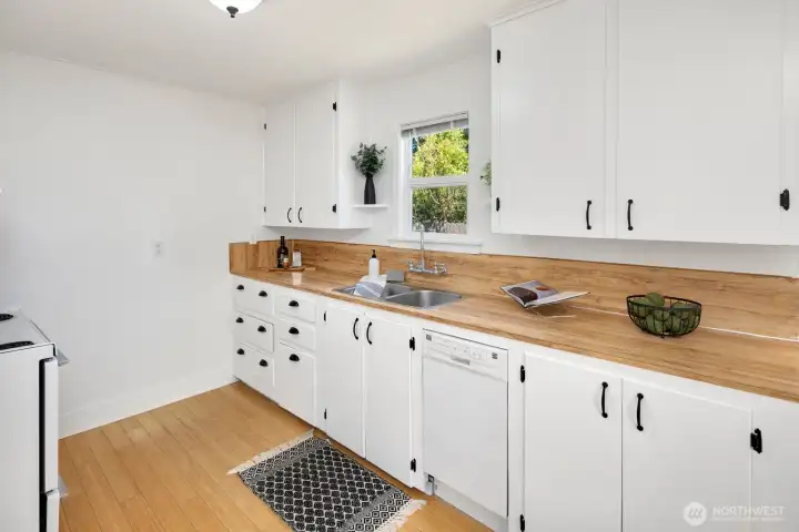 Kitchen: Lots of counter space and storage, plus a dishwasher!