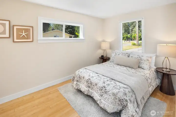 Primary bedroom with lots of light.