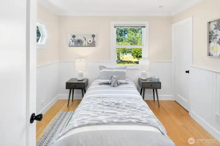 Second bedroom with a closet and access stairway to the basement level.
