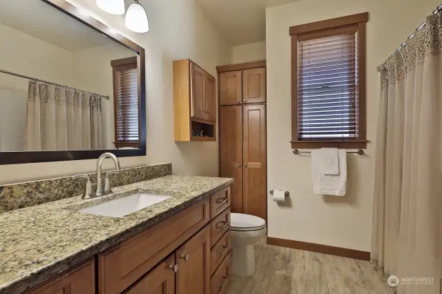 Full bath with a built-in linen closet. This bath is adjacent to the 2nd Bedroom.