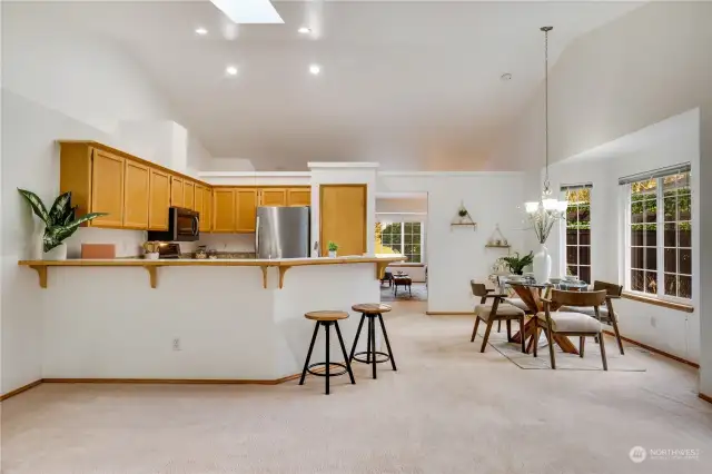 There is plenty of seating at the counter when guests come to visit. The skylight in the vaulted ceiling allows for added sunlight in this room too. Let's explore the rest of the home now!