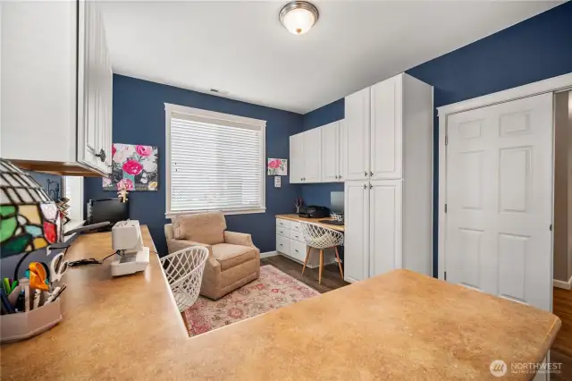 So many choices to make use of this exceptional office/craft room.