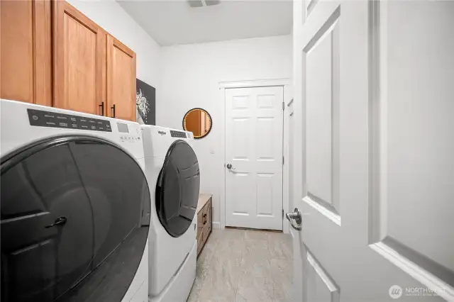 Washer and Dryer stay in this laundry room/mud room that takes you to the garage.